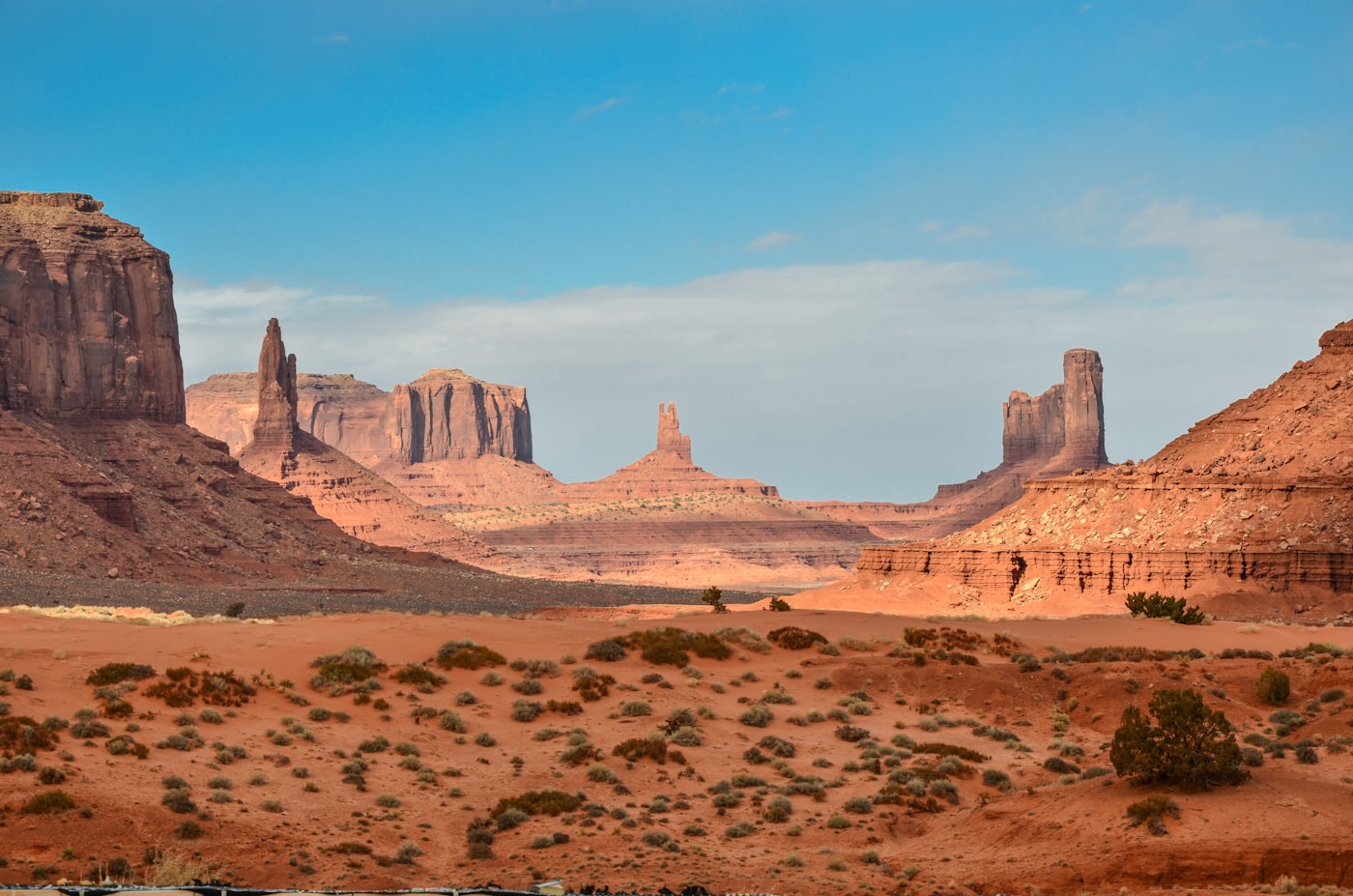 Wide desert landscape bathed in warm golden light